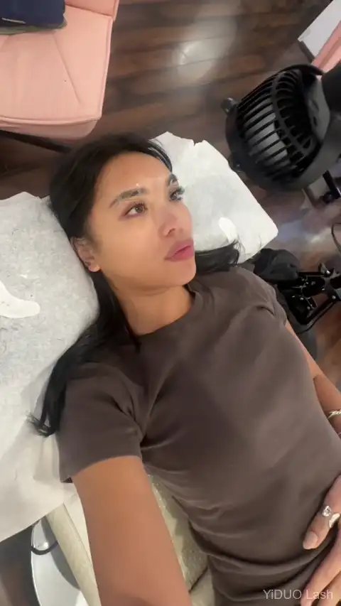 KOLYBEL premade lash fans being examined &mdash; thin pointed bases for easy isolation